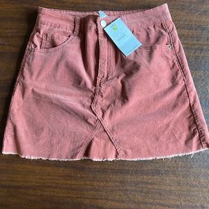 Figleaf brand. Mauve corduroy short skirt. Size medium. Brand new with tags.
